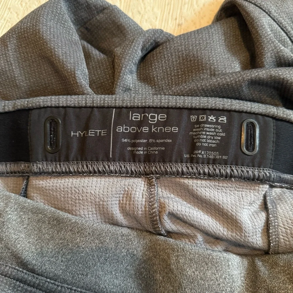 Hylete above knee drawstring zipper pocket athletic shorts